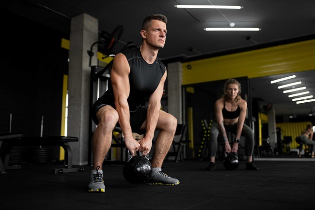 "Man lifting dumbbells during a strength training workout."